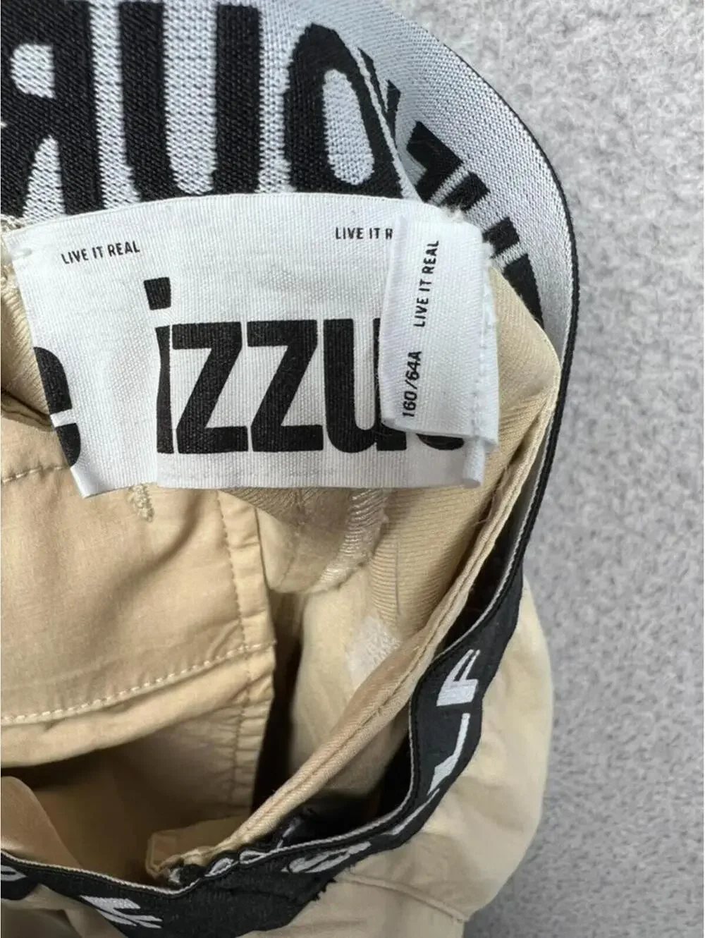IZZUE Yourself Khaki Pleated Trousers Logo Waistband Tapered Pants Womens 29 In